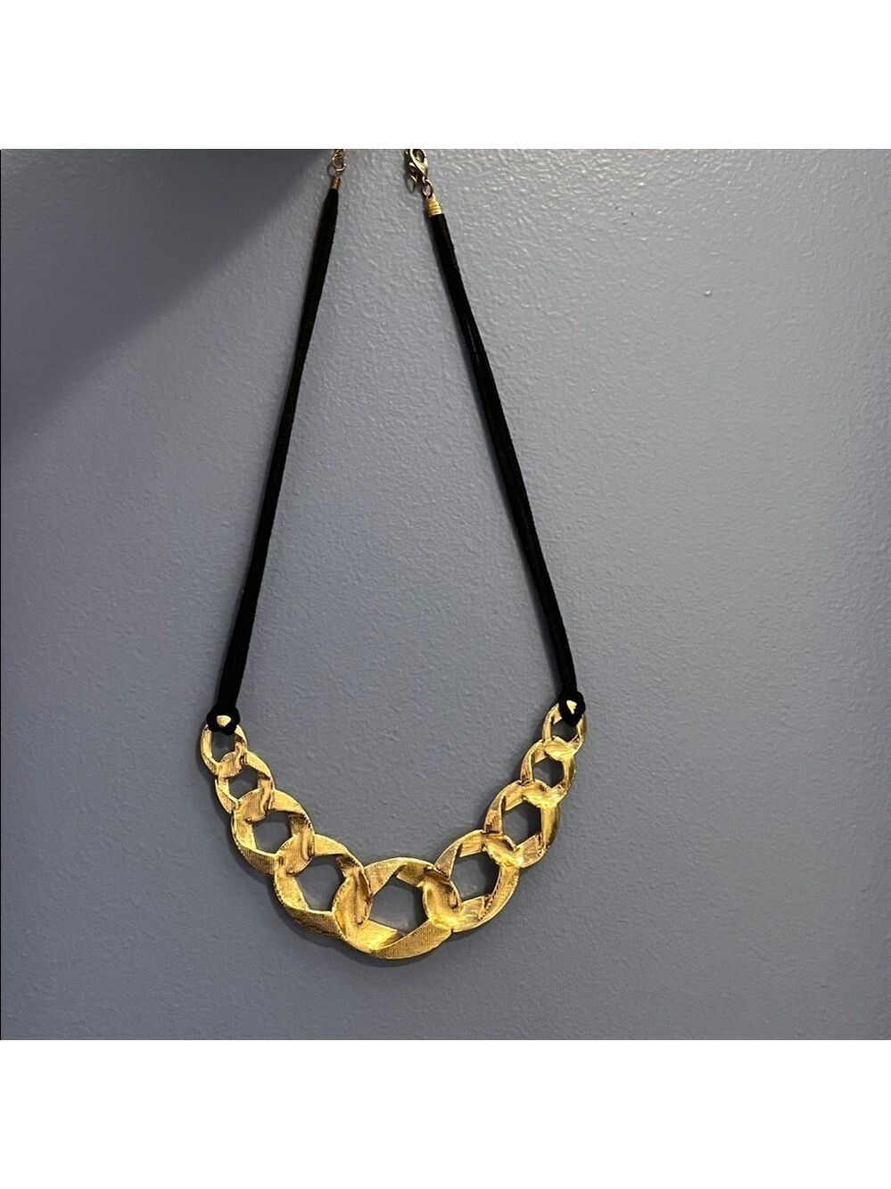 Gold tone metal and black cord Statement Necklace